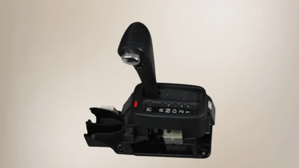 Nissan Xtrail T30 gear selector with a light brown background.