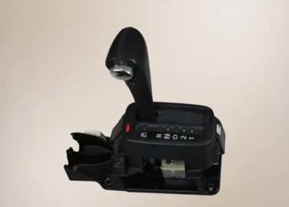 Nissan Xtrail T30 gear selector with a light brown background.